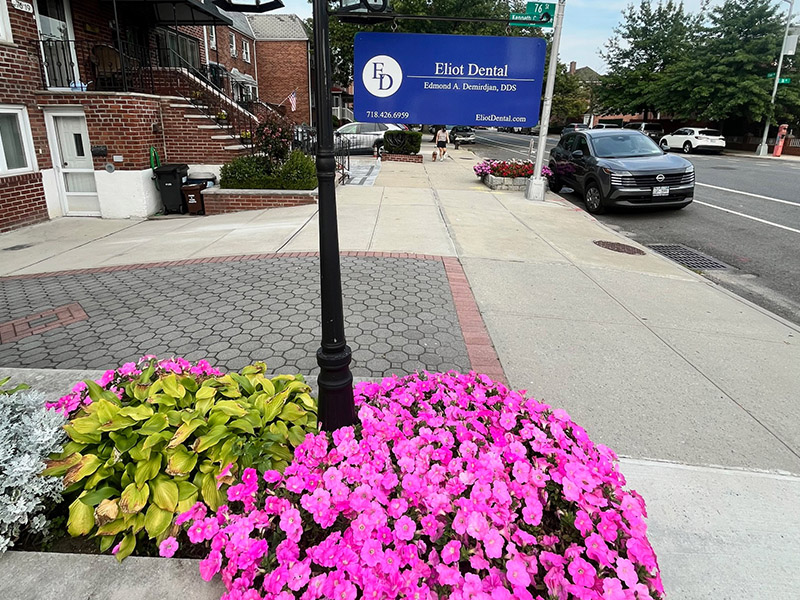 The image shows a street sign with the name  Eliot Dental  on it, indicating the presence of a dental practice at this location.